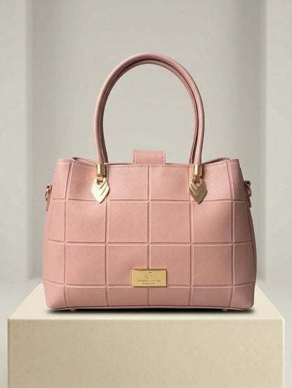 Blush pink quilted handbag displayed in Choice@Glance boutique with gold hardware