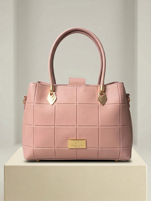 Blush pink quilted handbag displayed in Choice@Glance boutique with gold hardware