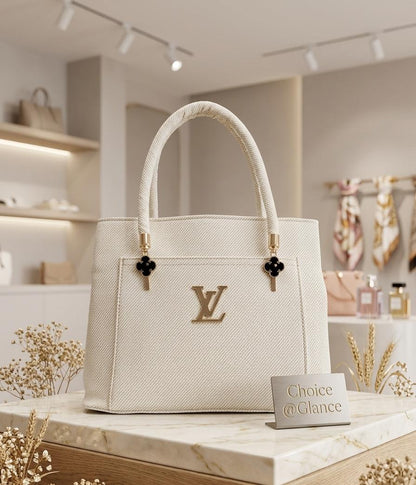 Two ivory rope-handle tote bags displayed in luxury store